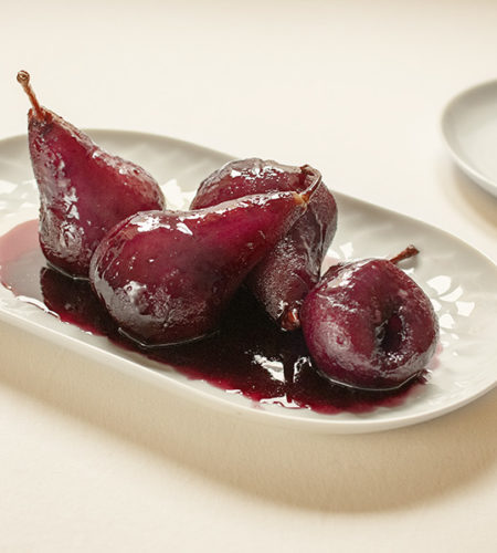 Pears cooked in red wine