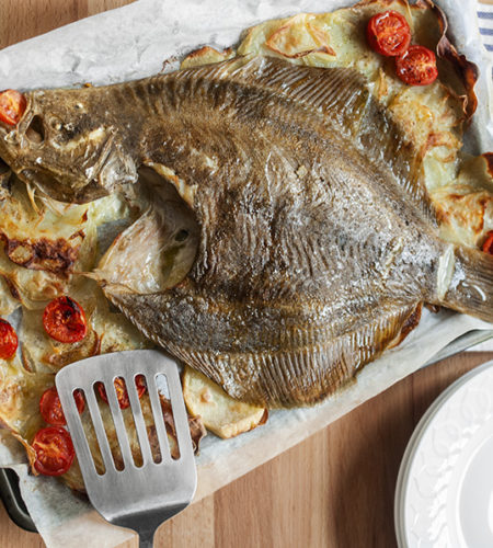 Baked turbot fish with potatoes