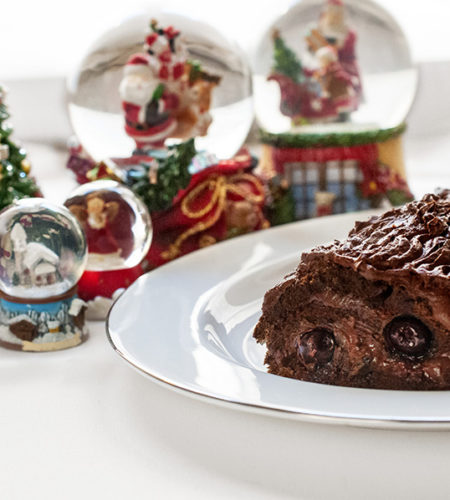 Christmas log with chocolate and black cherries