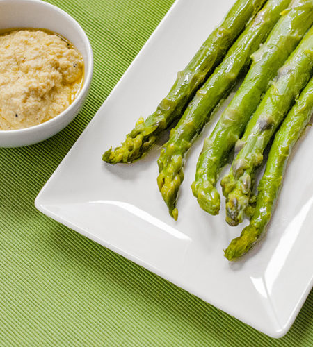 Microwave cooked asparagus with egg sauce